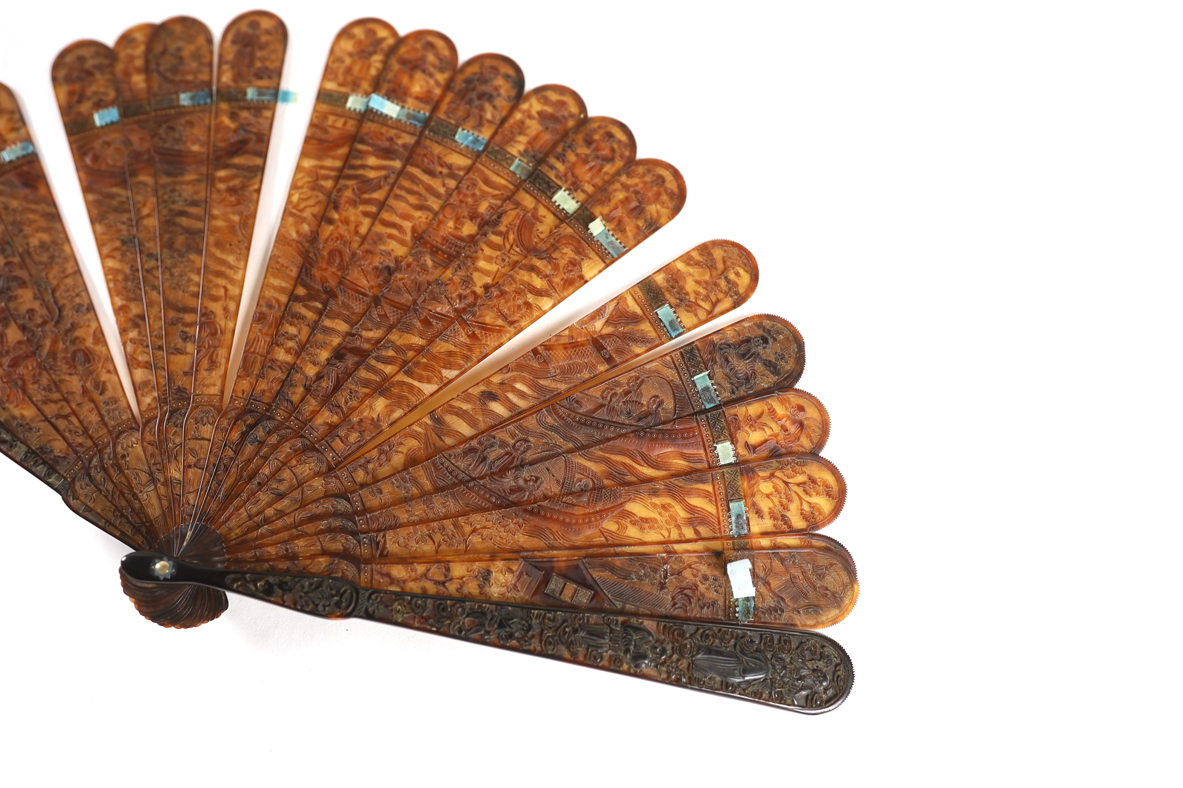 A 19th century Chinese finely carved tortoiseshell brisé fan, 18cm high